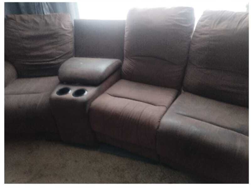 Clean reclining sofa sections after professional deep cleaning.