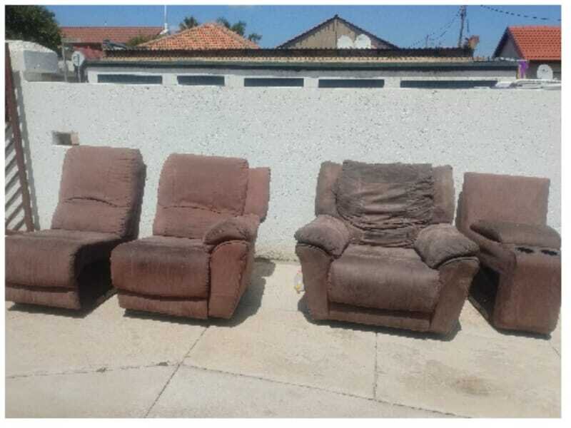 A cleaned sofa set arranged outdoors after upholstery care.